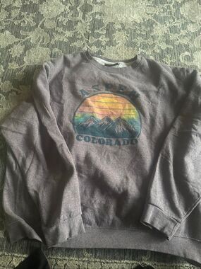 Graphic Images dark gray or washed brown crewneck sweatshirt featuring a colorfu